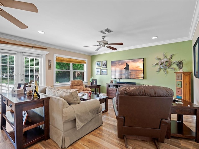 living room with crown molding, french doors, light wood-type flooring, and ceiling fan