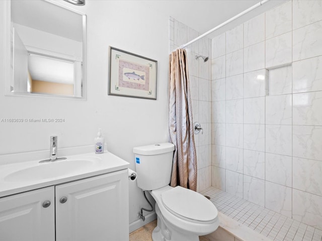 bathroom featuring vanity, a shower with shower curtain, and toilet