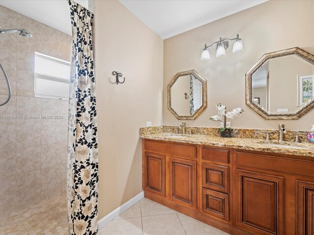 bathroom featuring vanity, tile patterned floors, and a shower with shower curtain