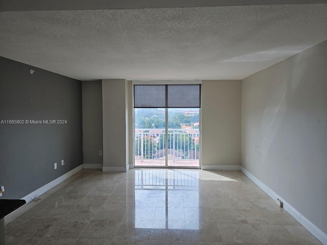 empty room with a textured ceiling