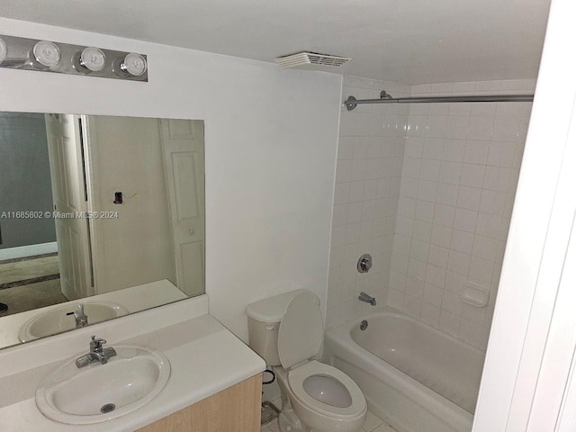 full bathroom featuring vanity, toilet, and tiled shower / bath