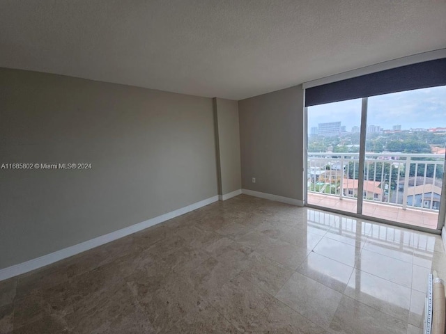 empty room with a textured ceiling