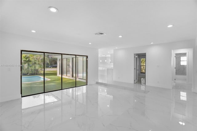 spare room featuring plenty of natural light