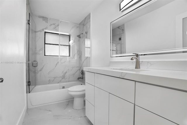 full bathroom with toilet, tiled shower / bath, and vanity