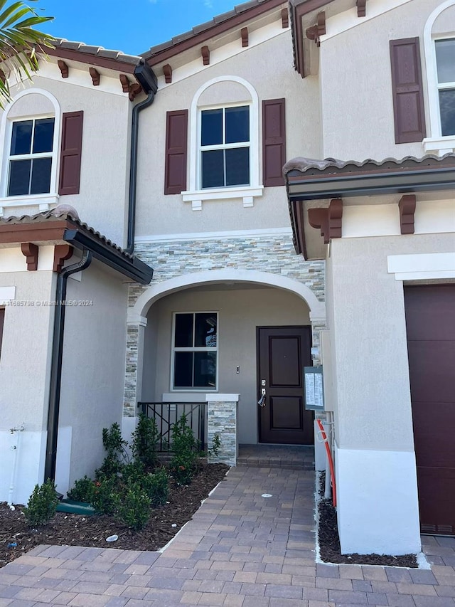 property entrance featuring a garage