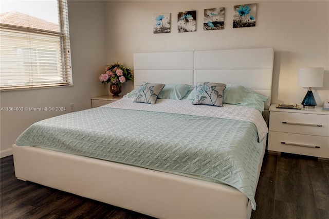 bedroom featuring dark hardwood / wood-style floors