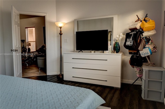 bedroom featuring dark hardwood / wood-style flooring