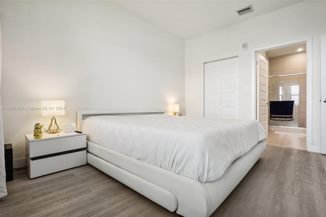 bedroom featuring a closet and hardwood / wood-style flooring