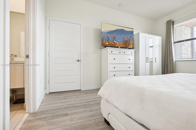 bedroom with light hardwood / wood-style flooring