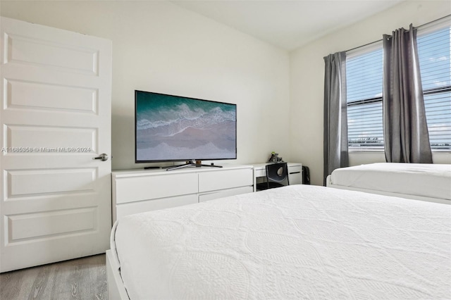 bedroom with light wood-type flooring