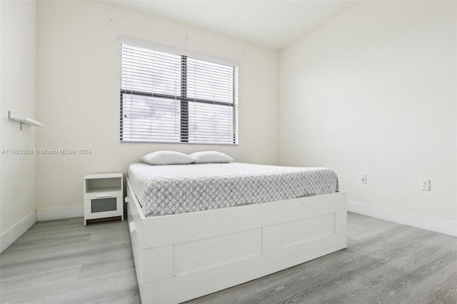 bedroom with light wood-type flooring