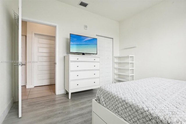 bedroom featuring hardwood / wood-style floors