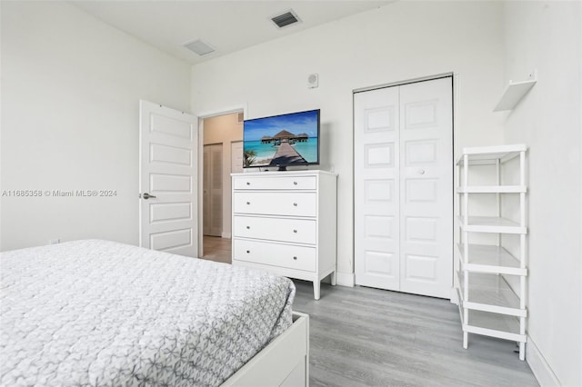 bedroom featuring a closet and wood-type flooring