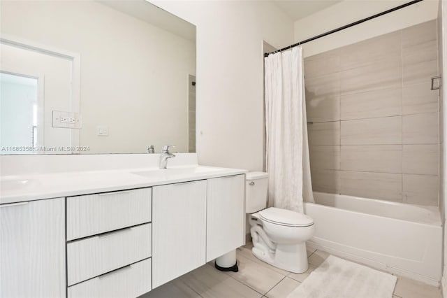 full bathroom with vanity, tile patterned flooring, toilet, and shower / tub combo