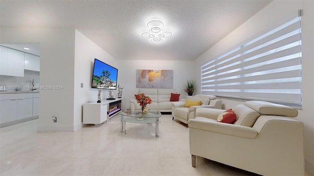 living room with a textured ceiling