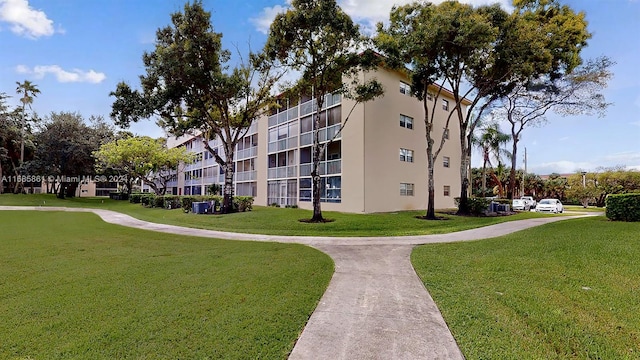 view of home's community featuring a lawn