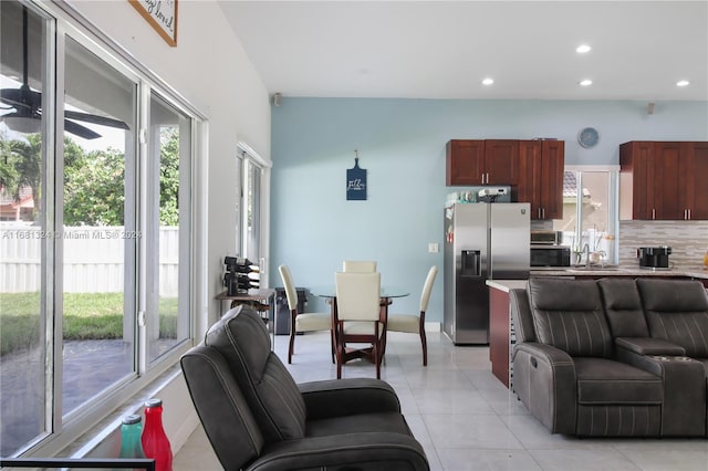 living room with light tile patterned flooring and sink