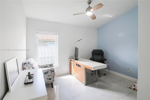 office space with ceiling fan and light tile patterned floors