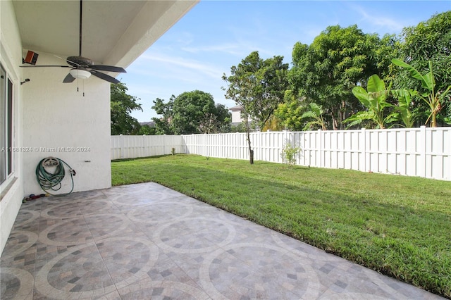 view of patio / terrace featuring ceiling fan