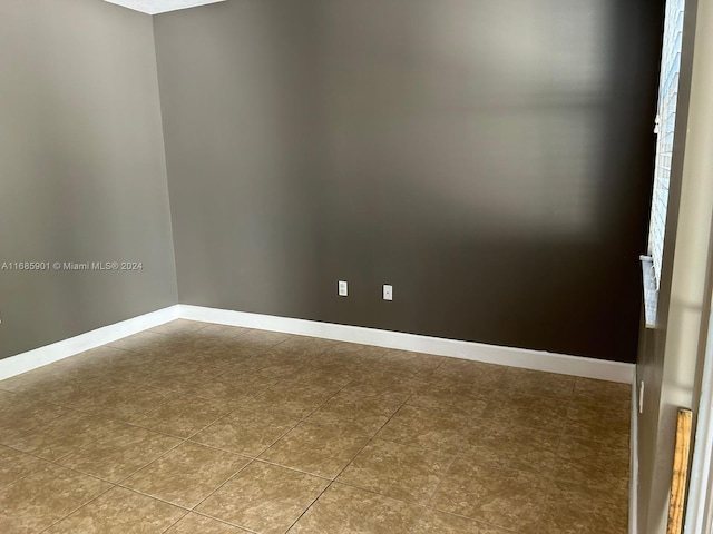 empty room featuring tile patterned flooring