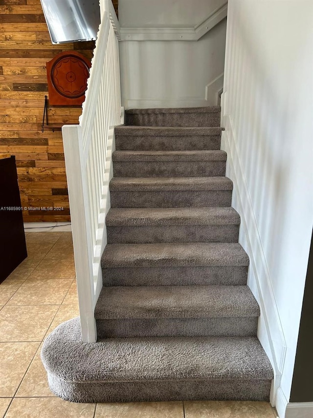 stairs with tile patterned flooring