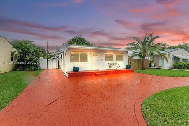 view of front of home with a yard