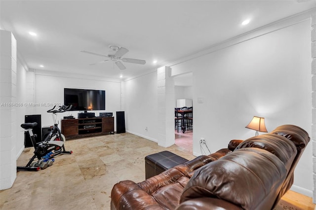 living room featuring ceiling fan and ornamental molding