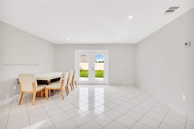 tiled dining area featuring french doors