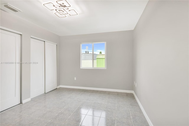 unfurnished bedroom featuring light tile patterned floors