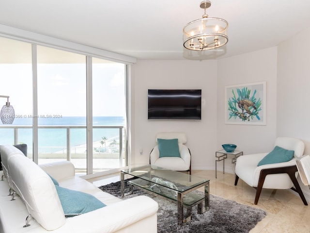 living room featuring tile patterned flooring, an inviting chandelier, and floor to ceiling windows