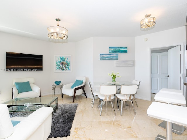 living room with a notable chandelier