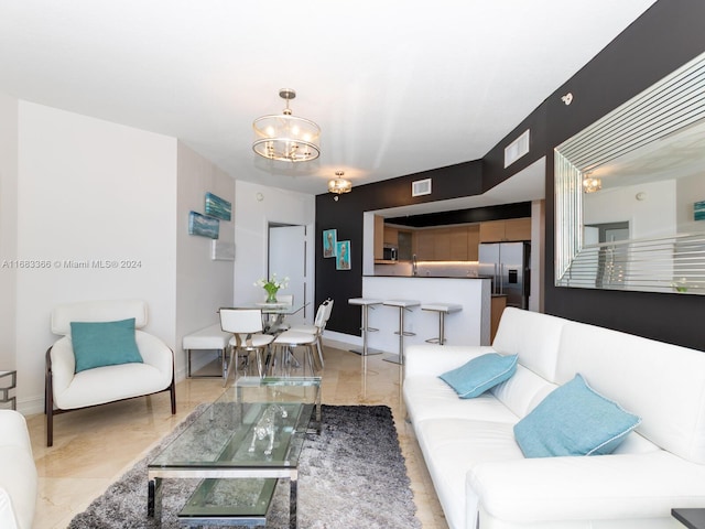 living room featuring a chandelier