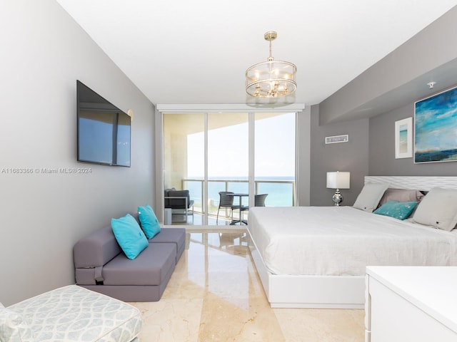 bedroom with a chandelier and floor to ceiling windows