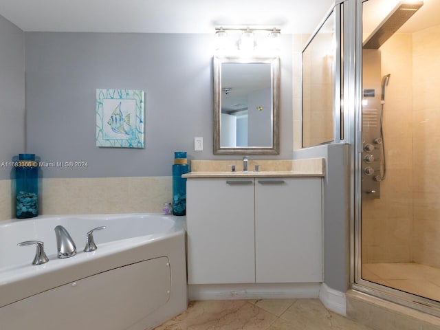 bathroom with tile patterned flooring, vanity, and independent shower and bath