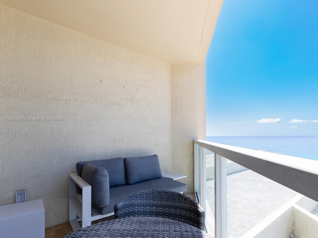 balcony featuring a water view