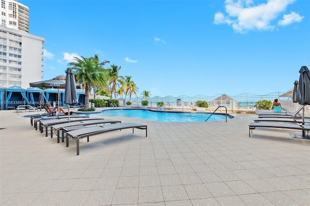 view of swimming pool with a patio area