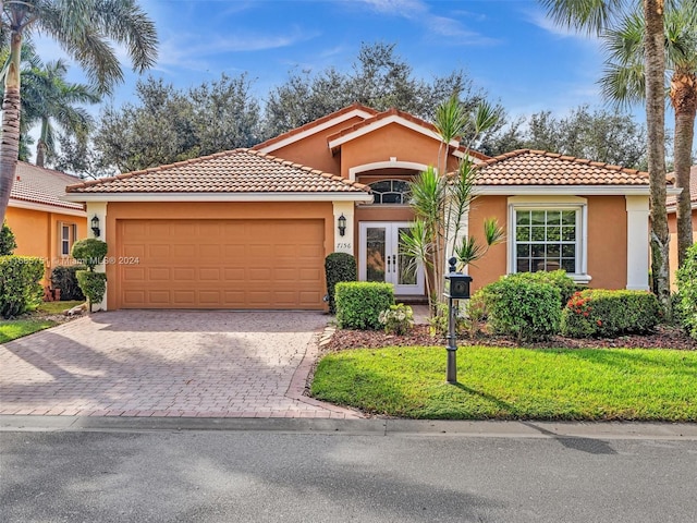 mediterranean / spanish-style home with a garage