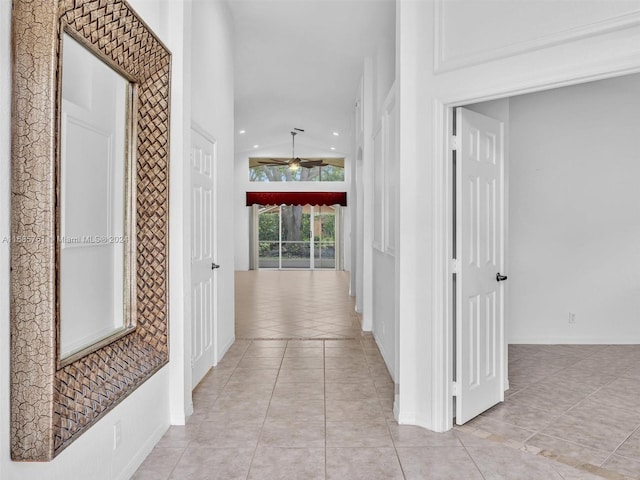 hall featuring light tile patterned floors