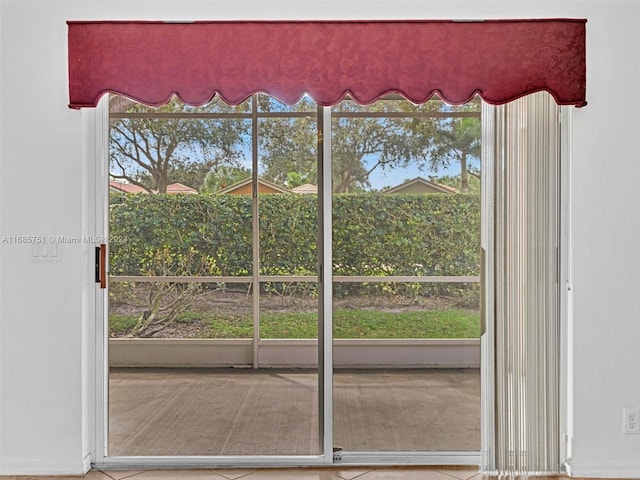 doorway to outside featuring plenty of natural light