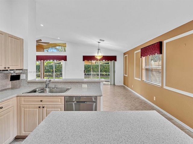 kitchen featuring sink, vaulted ceiling, and a healthy amount of sunlight