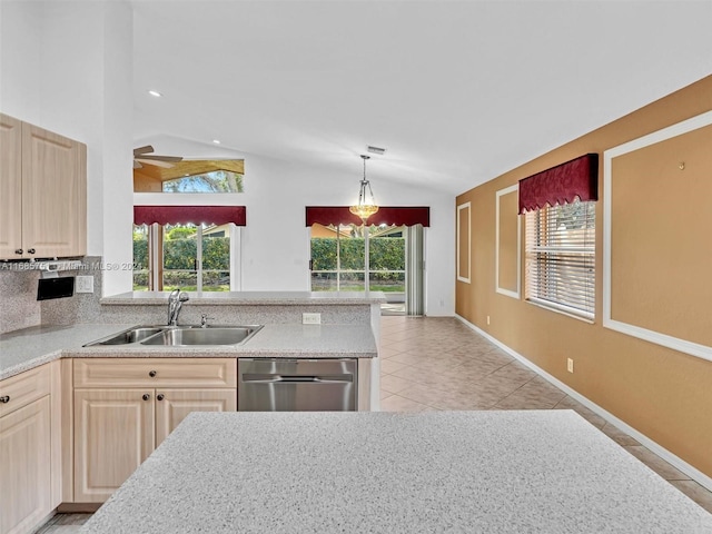 kitchen with a sink, dishwasher, lofted ceiling, light brown cabinetry, and ceiling fan