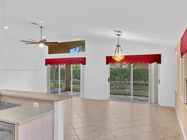 kitchen featuring decorative light fixtures, ceiling fan, stainless steel dishwasher, and light tile patterned floors