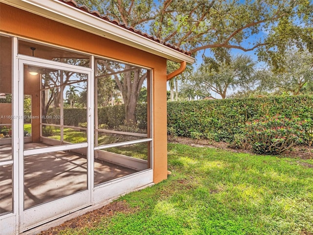 view of yard featuring a sunroom