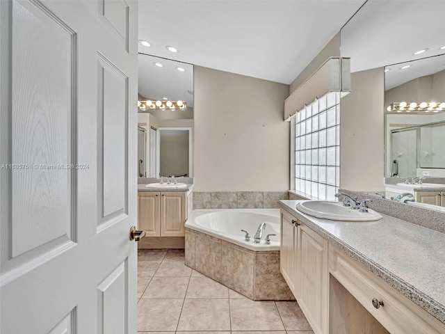 bathroom featuring vanity, shower with separate bathtub, and tile patterned flooring