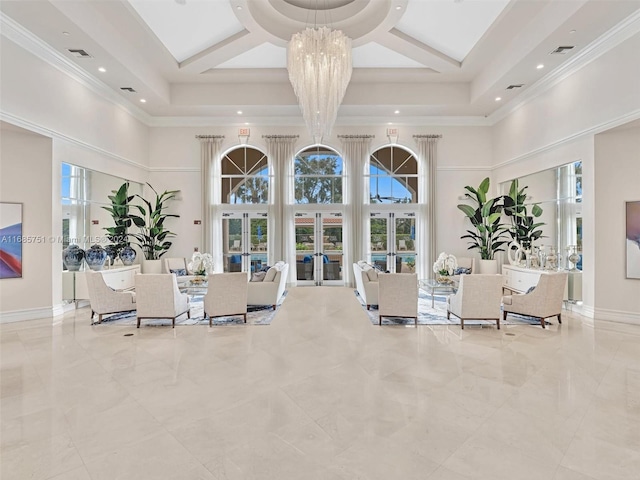 community lobby featuring a towering ceiling and recessed lighting