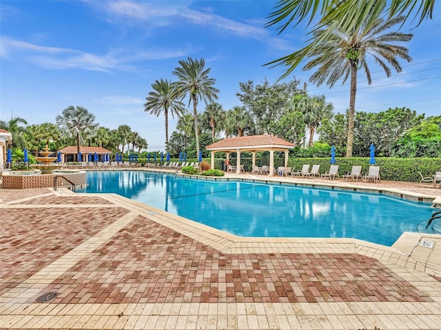 view of swimming pool with a gazebo and a patio area