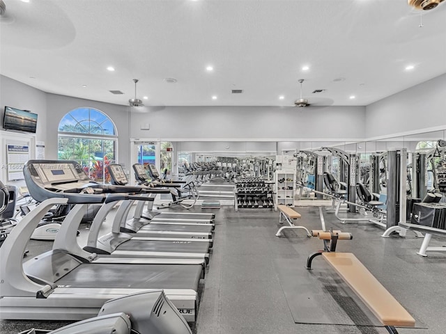 gym with a textured ceiling and ceiling fan