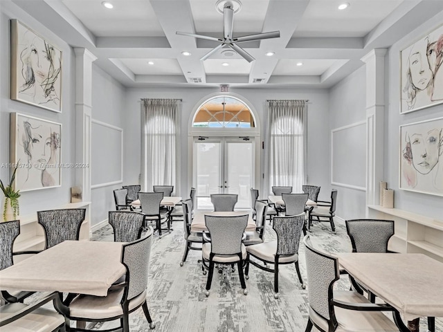 dining room featuring coffered ceiling, french doors, beamed ceiling, a towering ceiling, and ceiling fan