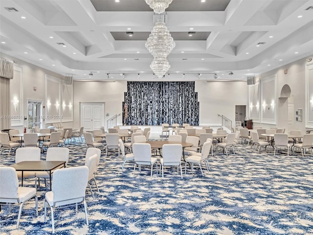 dining area featuring a high ceiling, coffered ceiling, beam ceiling, a chandelier, and carpet flooring