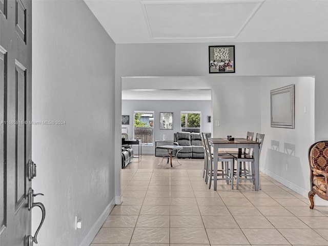 dining space with light tile patterned floors